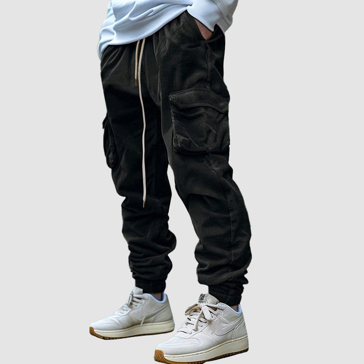 Blå herr vintage joggerbyxor med praktiska fickor, perfekt för en avslappnad look.
