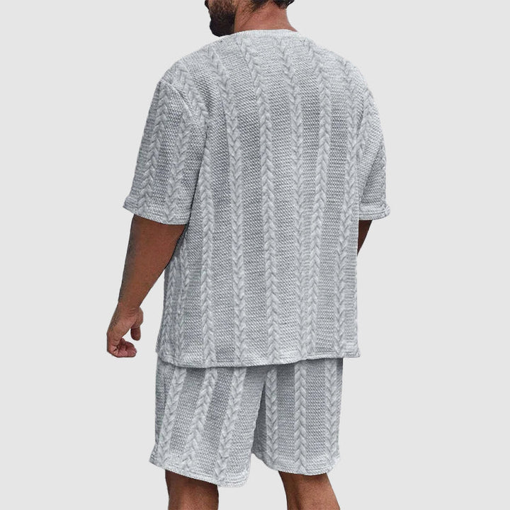 Trendig urban träningsoverall för herrar. Modernt shortsset för sportmode och bekväm fritid året runt.