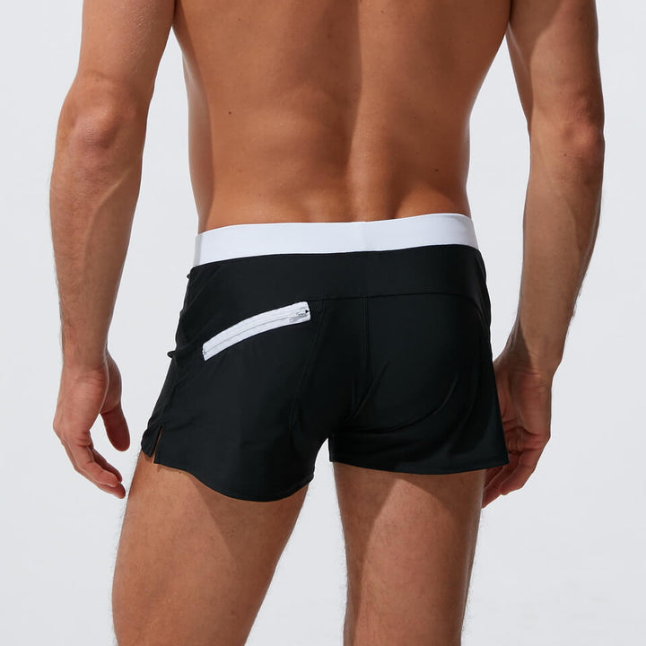 Herrbadbyxor i snabbtorkande polyester-spandex med dragsko, perfekta för simning och vattensport.
