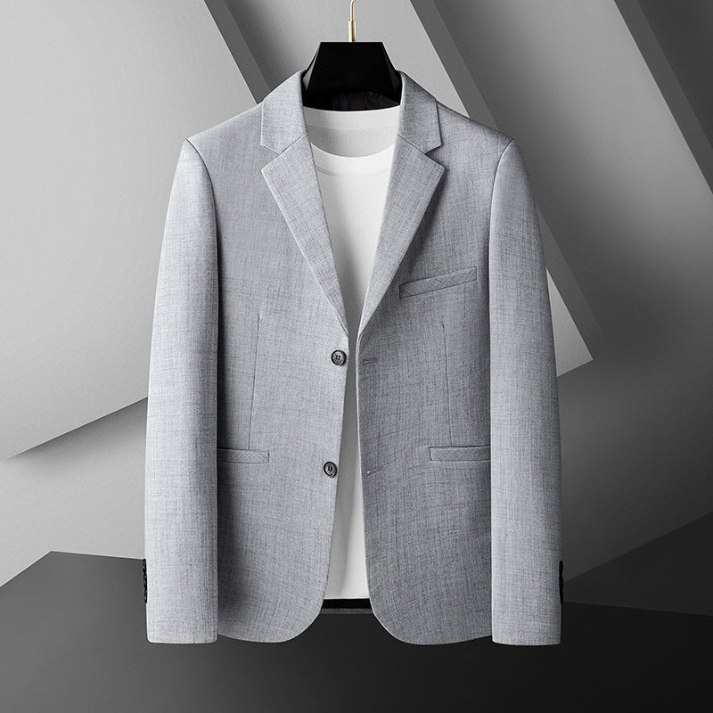 Beige herrblazer i modern passform med stilren krage. Mångsidig kostymjacka för fritid och festkläder.