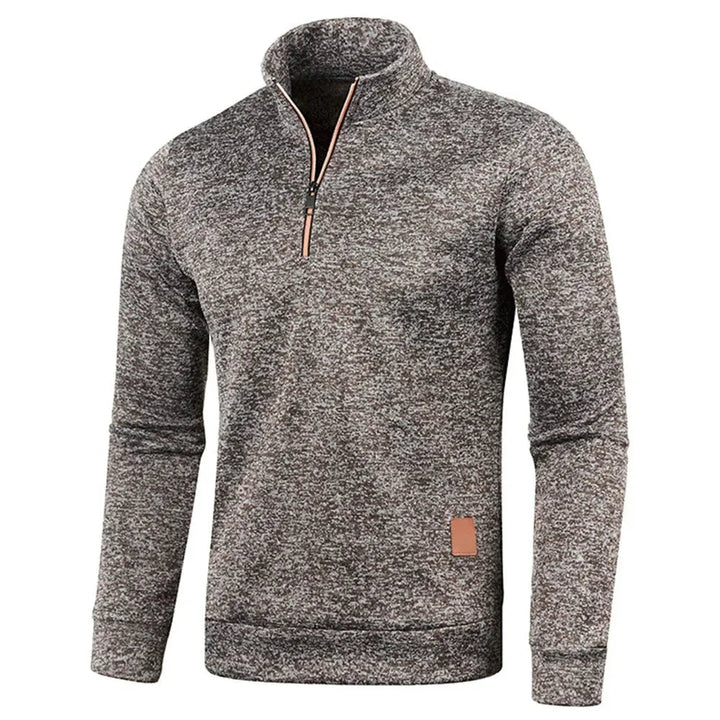Sportig herrfleece med halv dragkedja. Bekväm och mångsidig herrtröja för aktiva män utomhus.