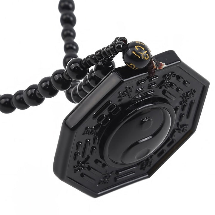 Herrhalsband: Obsidian Yin Yang för balans & skydd, ett kraftfullt smycke.