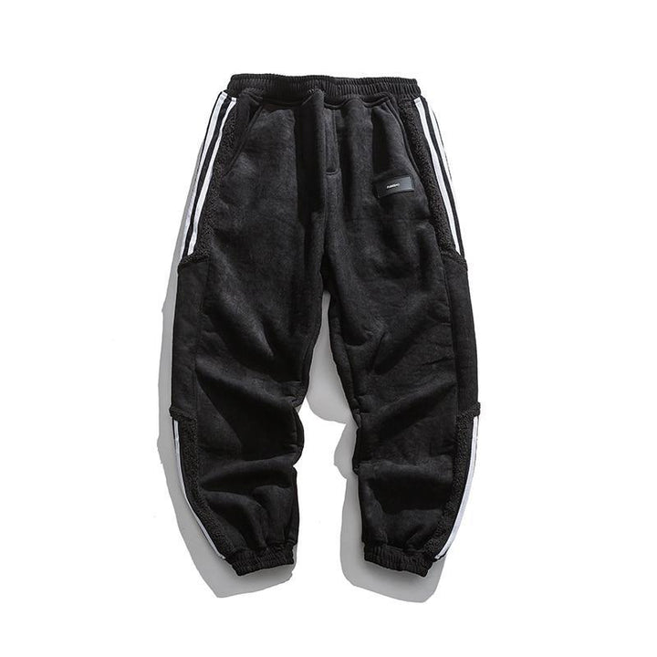 Herrjoggers med sidosträckning, perfekta för en aktiv livsstil. Stilrena fritidsbyxor i trendig design.