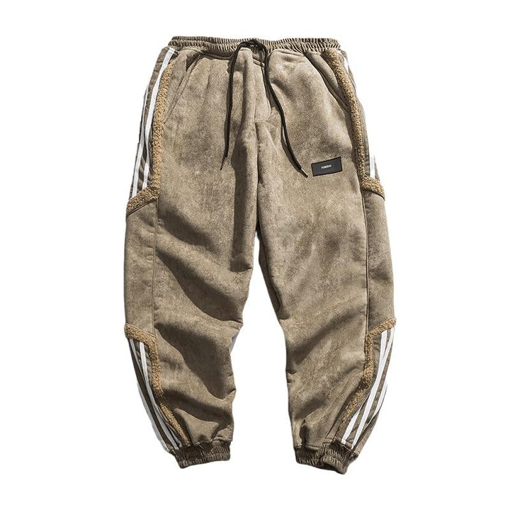 Stilrena herrjoggers i svart med sidosträckning. Bekväma, sportiga byxor som passar för streetwear.