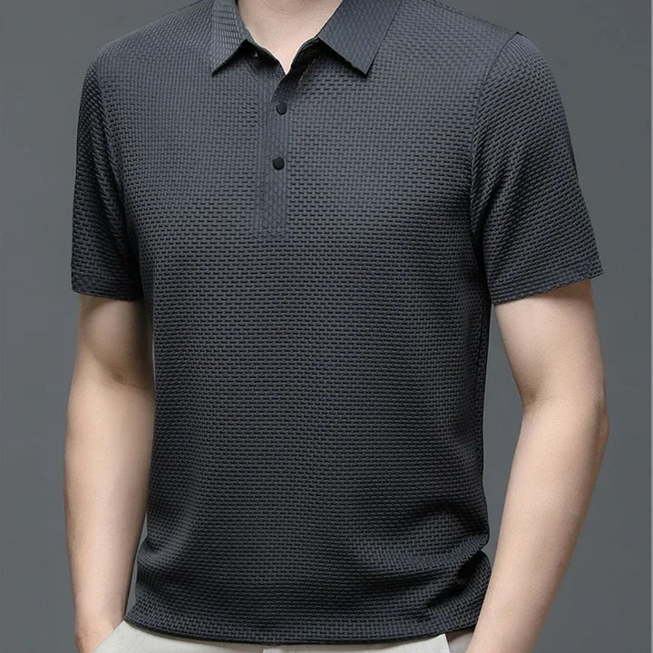 Stilren herr pikétröja, perfekt för en elegant sommarlook. Lättviktig och andningsbar komfort.