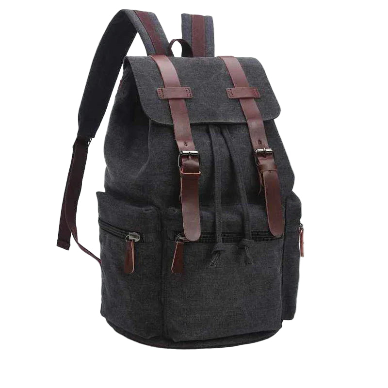 Herrryggsäck i vintage canvas/läder. Funktionell dagsryggsäck med lock och fickor för arbete & resa.