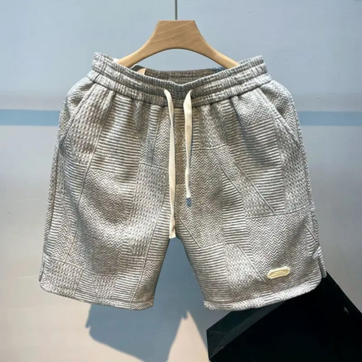 Sportiga herrshorts med vågmönster, optimala för träning eller som avslappnade fritidsshorts med stil.