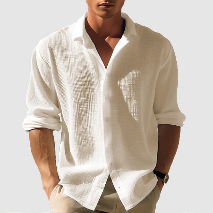 Klassisk button-down herrskjorta långärmad. Enkel enfärgad design, perfekt för business casual eller vardagsbruk.
