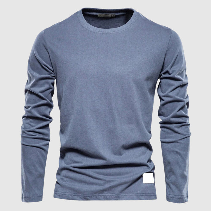 Snygg enfärgad herrskjorta, perfekt för formella tillfällen eller avslappnad vardagsstil. Tidlös design.