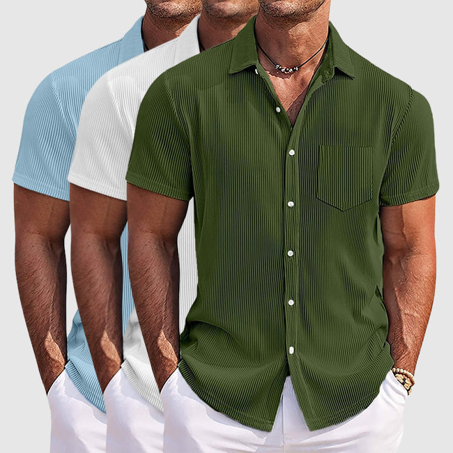 Klassisk herrskjorta i bomull/polyester med nedfälld krage, knappar och vardagsanpassad passform.