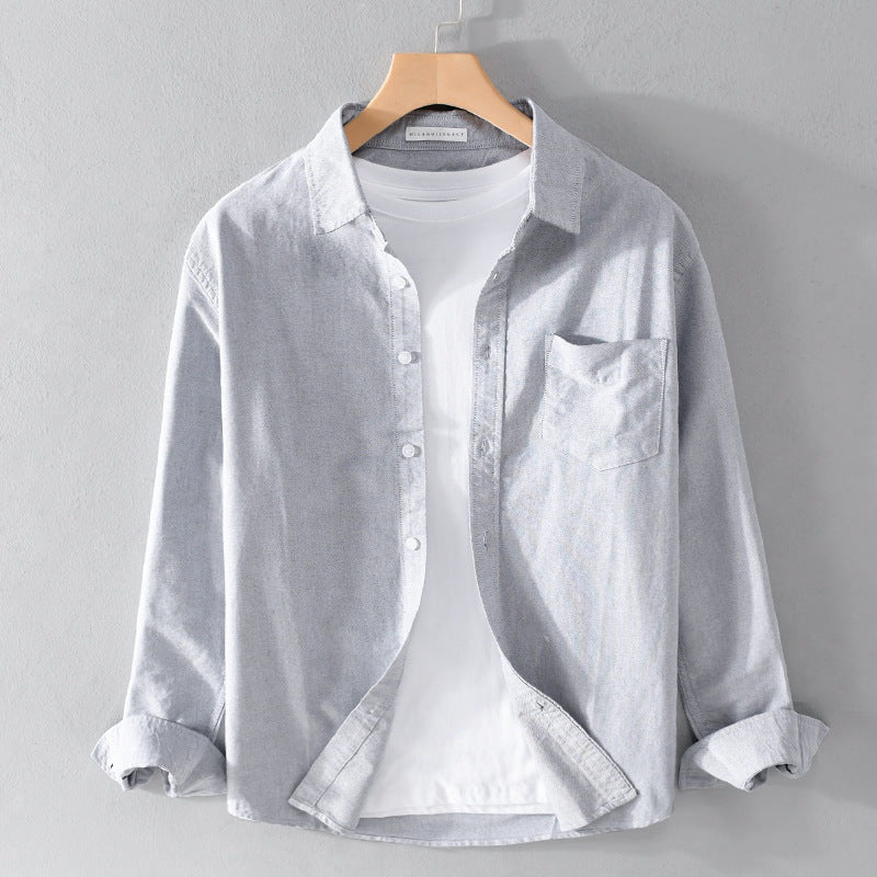 Bekväm enfärgad herrskjorta i grått med nedfällbar krage, långa ärmar, smartcasual stil