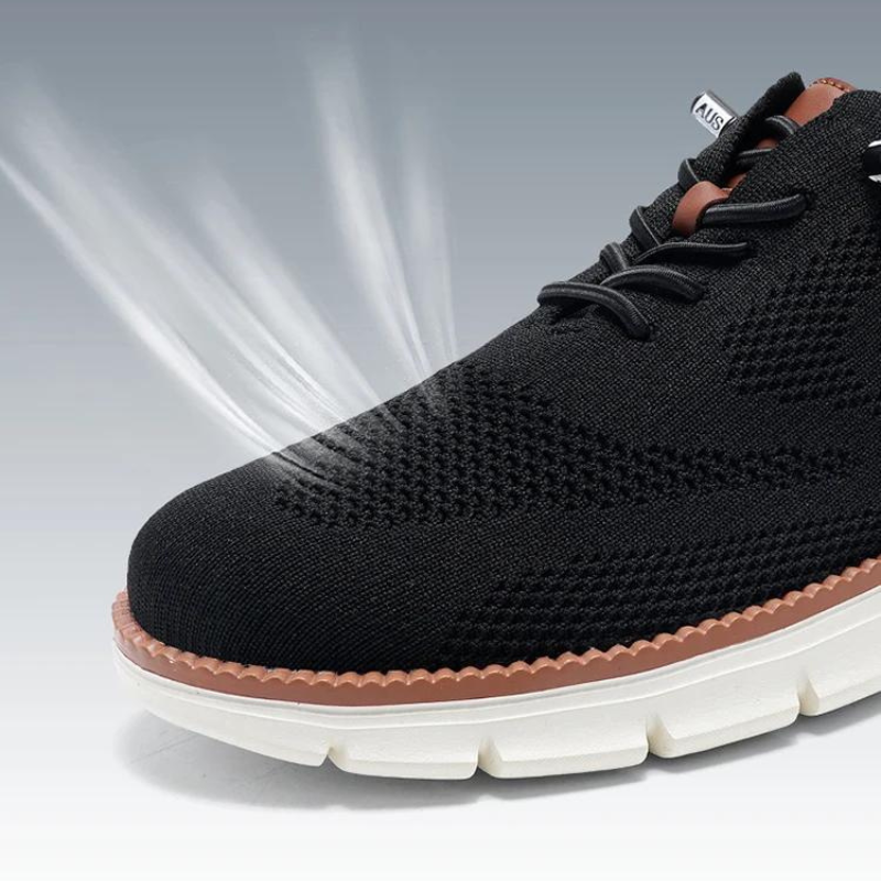 Moderna herrskor: Blå och grå andningsbara casual sneakers, fotograferade underifrån för att visa sulans grepp.
