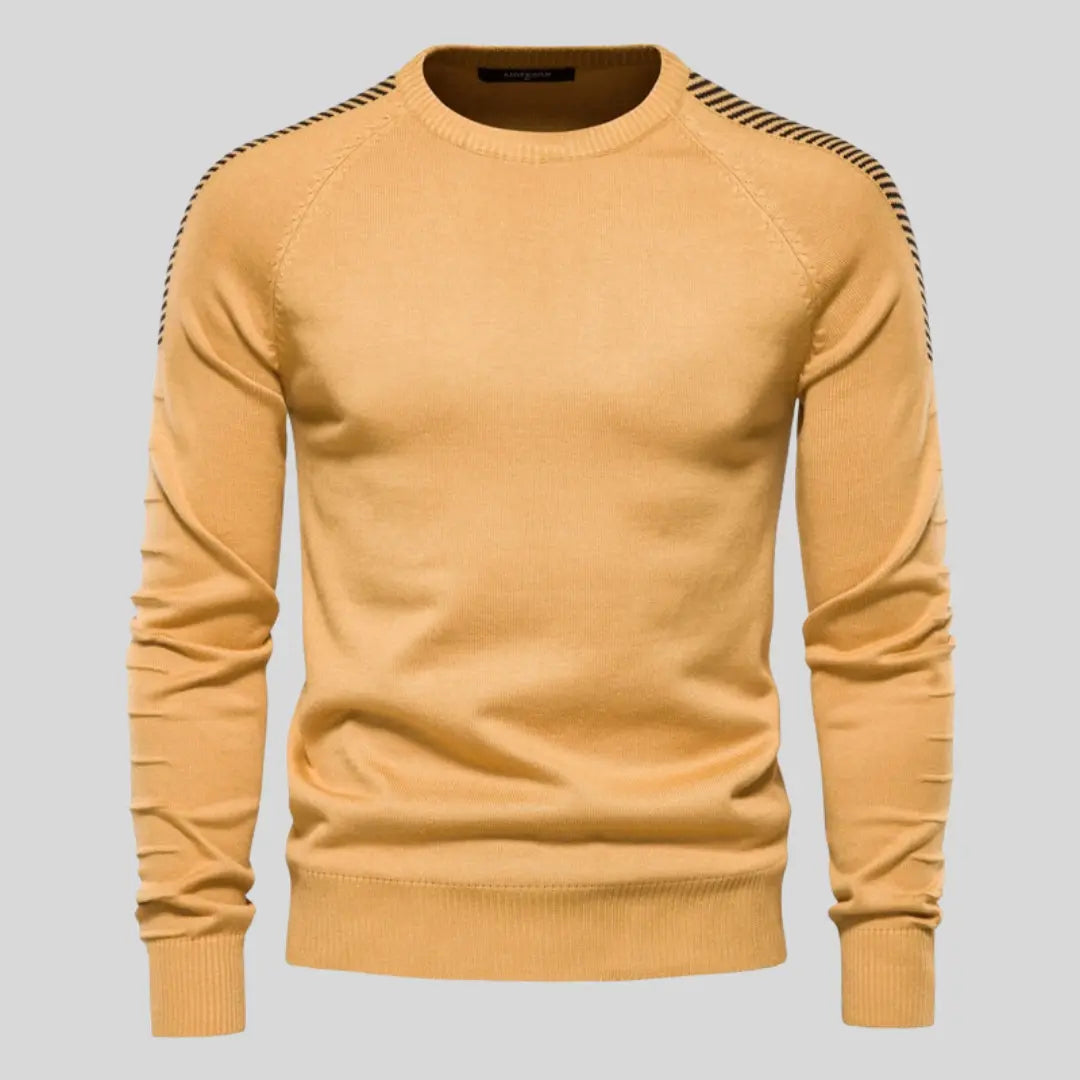 Stilren herrtröja med modern passform som framhäver siluetten. Tidlös design för en mångsidig garderob.