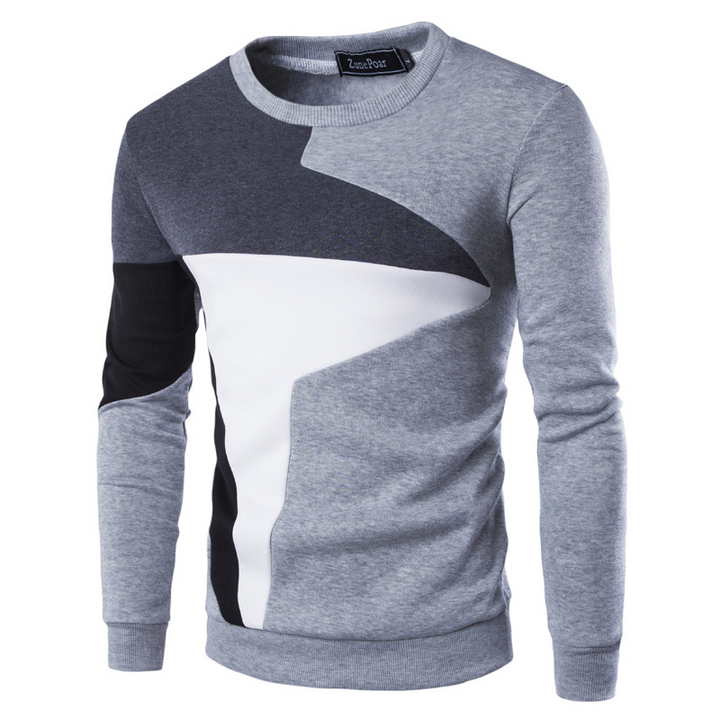 Trendig herrtröja med färgblock. Rundhalsad och bekväm för en avslappnad men stilren look, idealisk för höstmode.