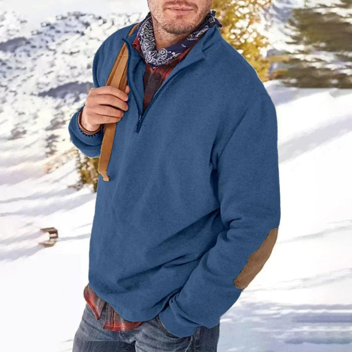 Stilren herrtröja med halv dragkedja och armbågslappar. Bekväm casual tröja för höst och vinter.