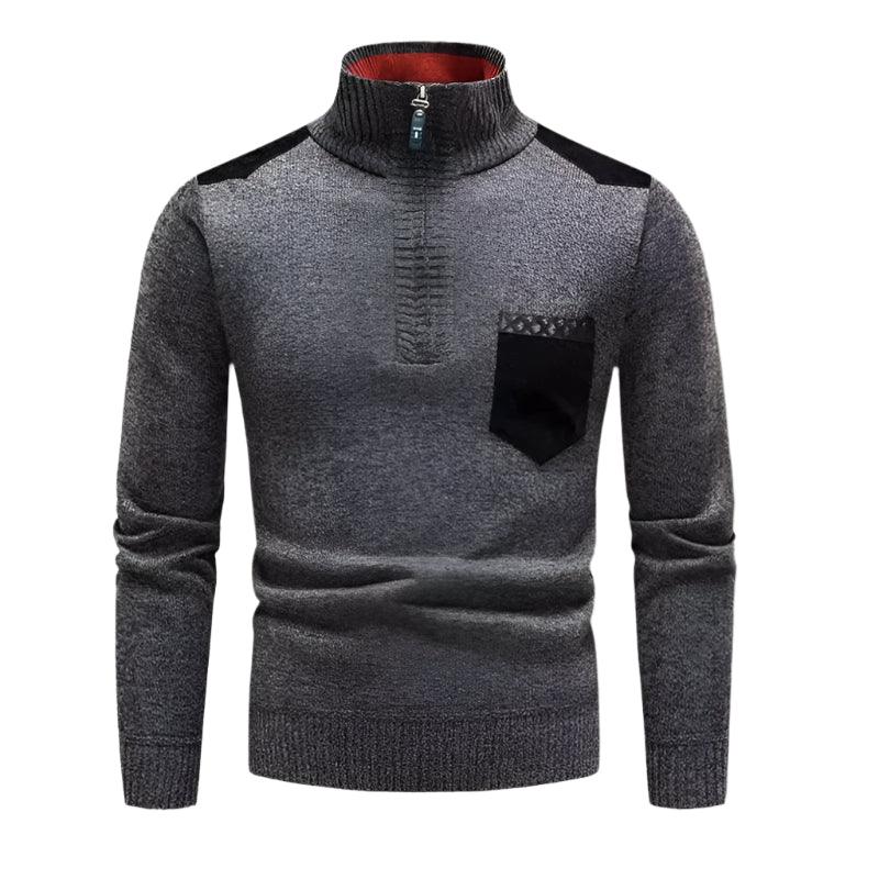 Klassisk herrtröja med halv dragkedja, ullkänsla och patchwork i fuskmocka. Elegant för smart casual.