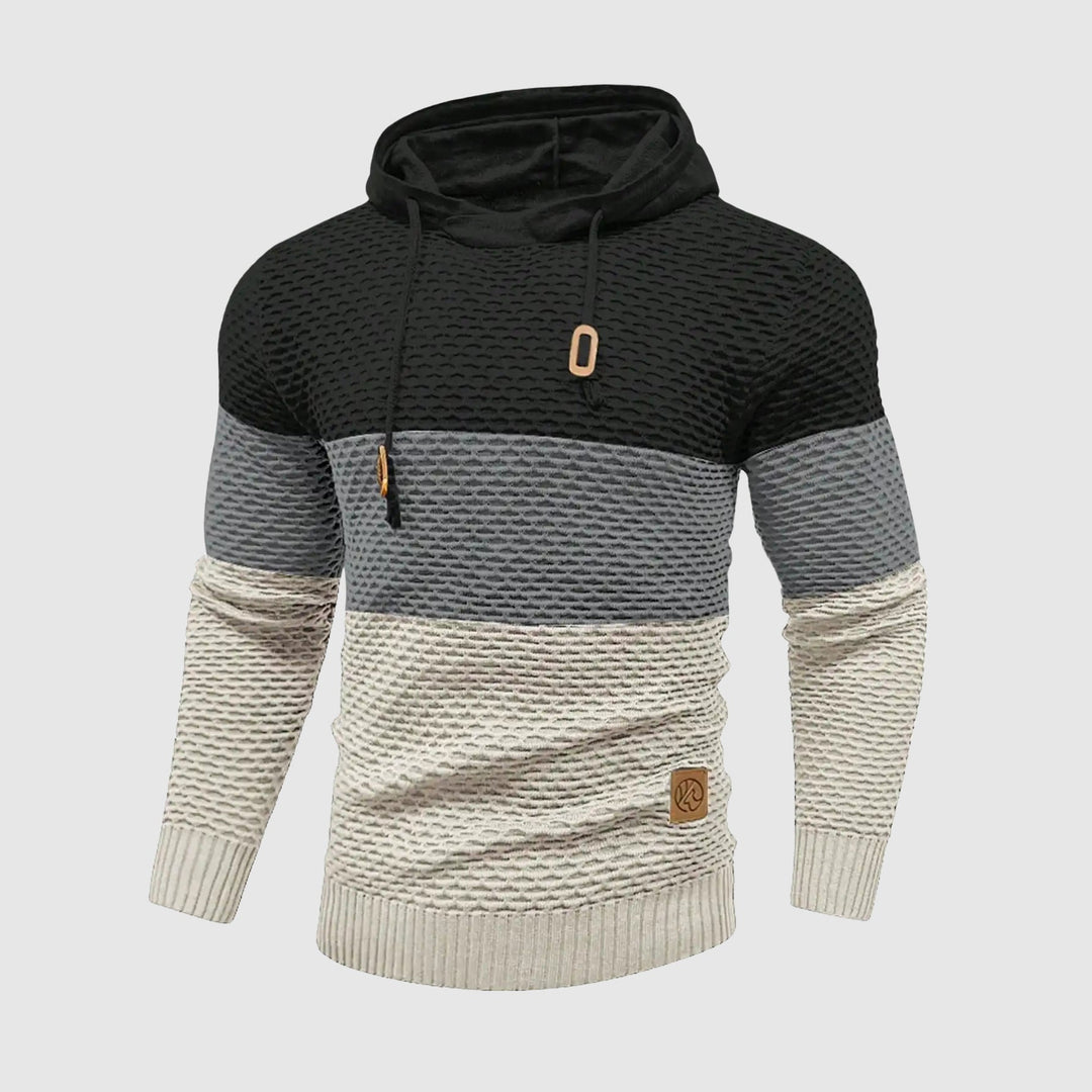 Bekväm, stickad herrtröja med huva i trefärgad design. Varmt och stilrent mode för herr.
