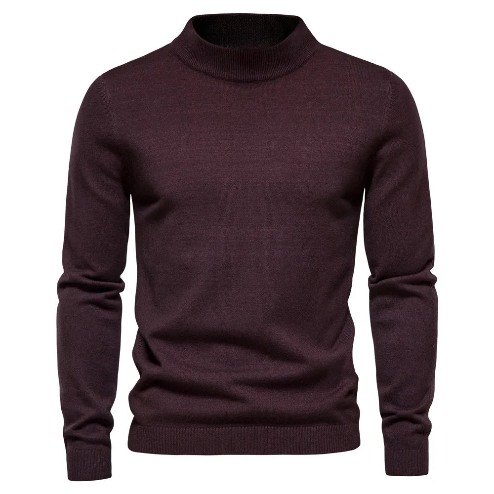 Vintermode: Stilren herrtröja med halvhög krage, varmrutig för en elegant look.