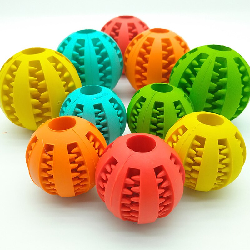 Gummi tuggboll för hundar. Tandrengörande leksak med fack för godis, motverkar plack och underhåller.