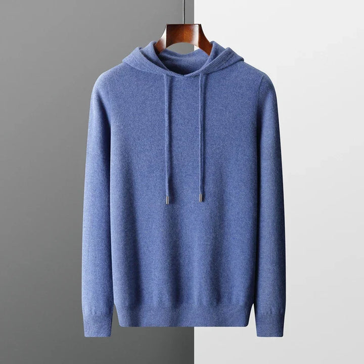 "Huvtröja i 100% merinoull, elegant och mjuk, perfekt för komfort och stil under kalla dagar."