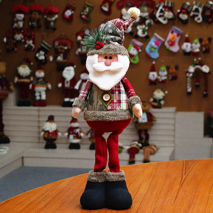 Justerbar juldocka, en populär julklapp. Välj mellan tomte, snögubbe eller ren som heminredning.