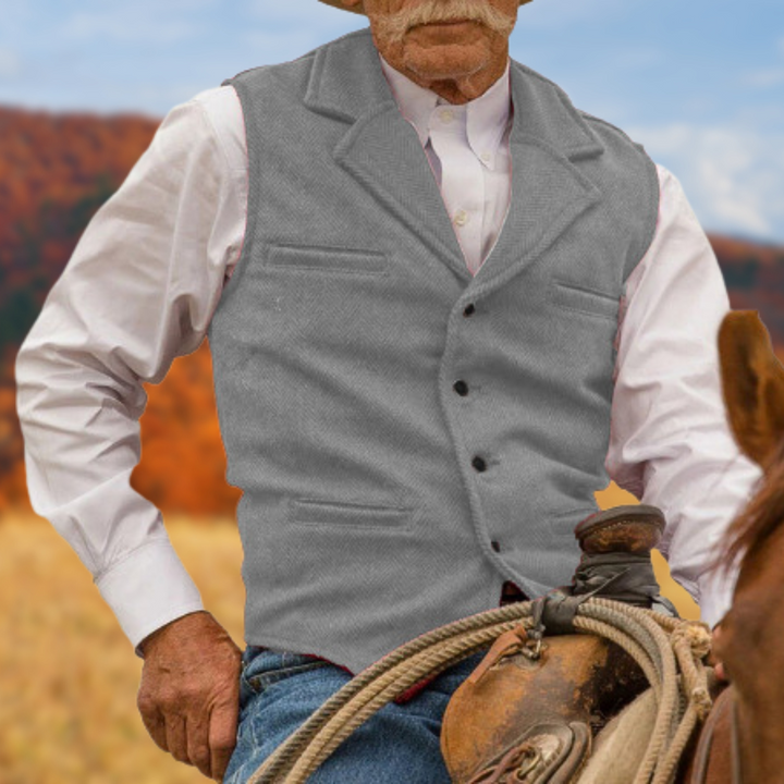 Stilfull man i klassisk herrväst, elegant för fest eller kontor. Passar vårmode och höstmode.