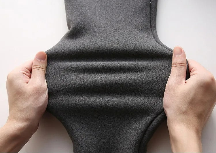 Kvinnors plyschfodrade leggings med hög midja, visas platt för att visa materialet.