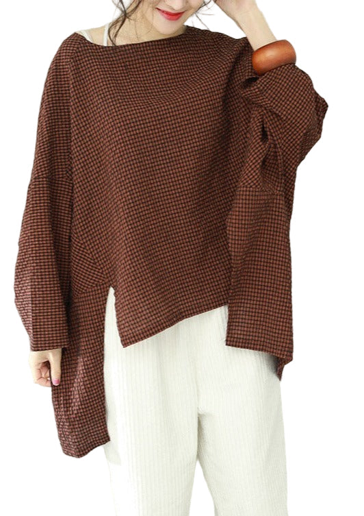 Kvinnors asymmetriska rutiga topp med modern design, perfekt för stilren vardag.
