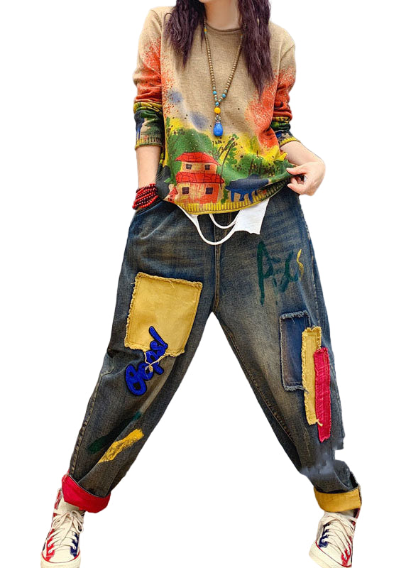 Lösa jeans för kvinnor med handgjorda patch-applikationer och elastisk midja.