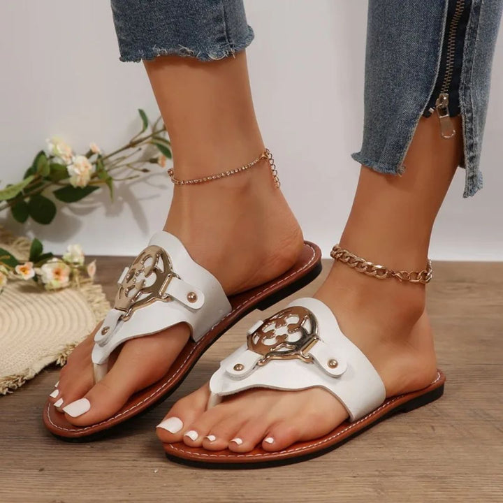 Mångsidiga platta sandaler för kvinnor med en unik, elegant design, perfekta för både fritid och vardag.