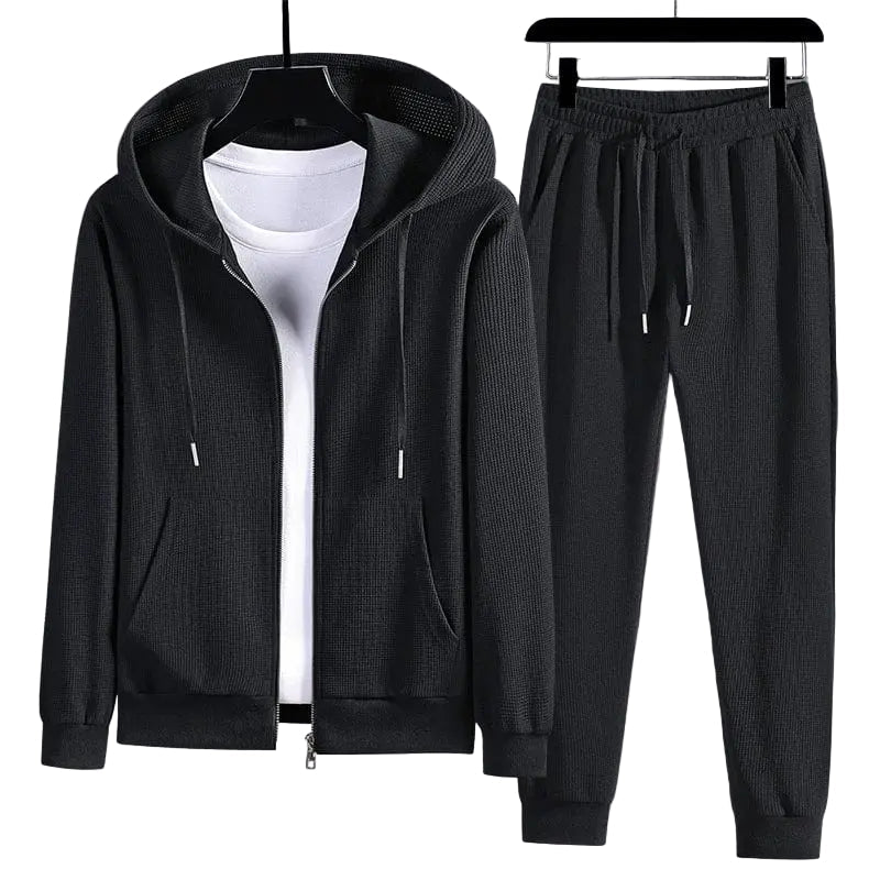Kvinnors bekväma våffelstickade loungewear-set med tröja och byxor för avkoppling hemma.