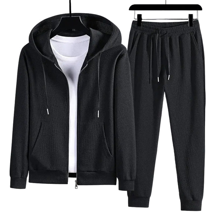 Kvinnors bekväma våffelstickade loungewear-set med tröja och byxor för avkoppling hemma.