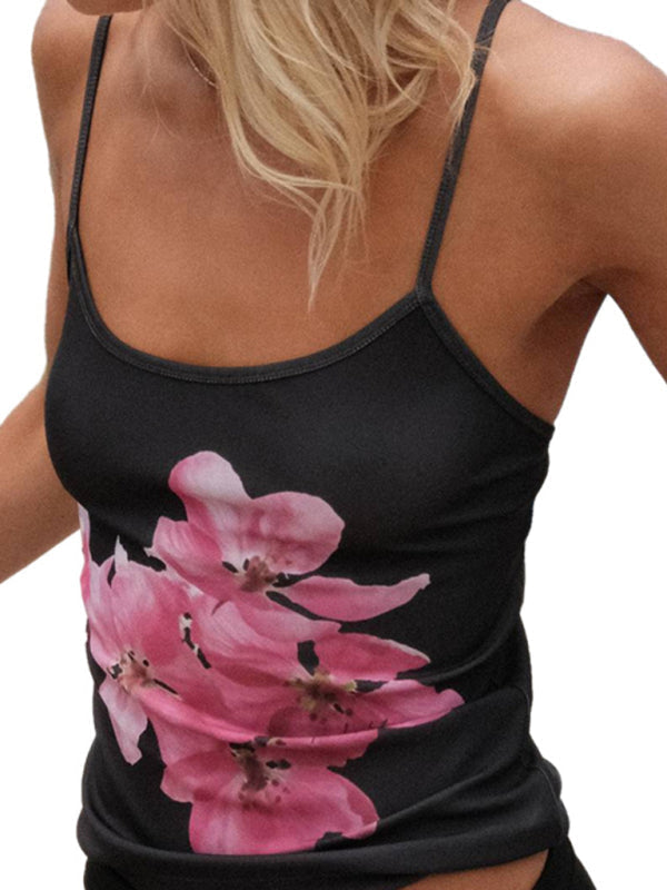Smal passform, blommig crop top för kvinnor med spagettiband. Trendig rygglös stil, utmärkt för sommarfester.