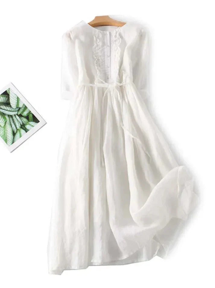 Chic, luftig sommarklänning i midi-längd för kvinnor. Elegant bohemisk stil, perfekt för varma dagar.