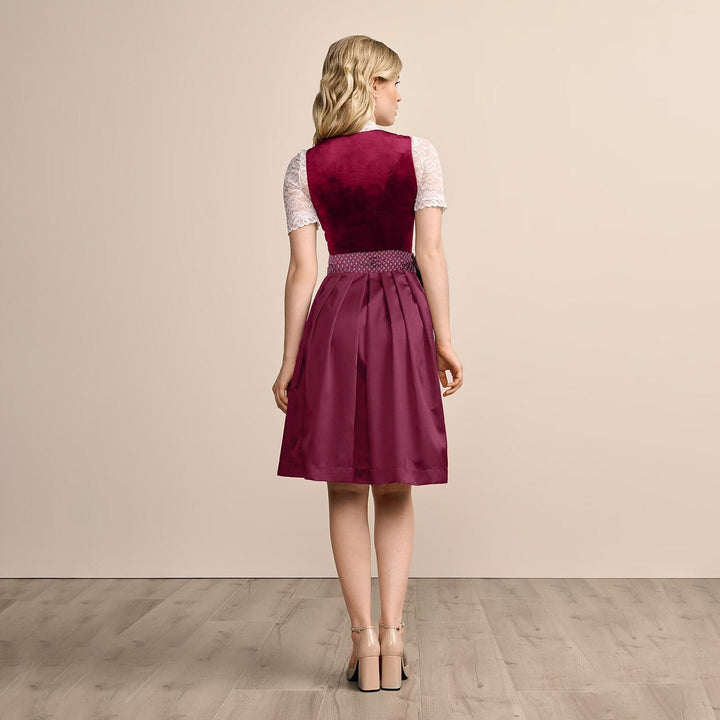 Blommönstrad Dirndl-klänning för kvinnor med svart förkläde, en klassisk bayersk festdräkt.