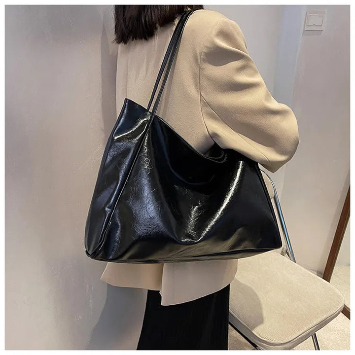 Stilfull bucketväska, kvinnors axelväska. Mångsidig och rymlig modeväska i elegant retro-stil.