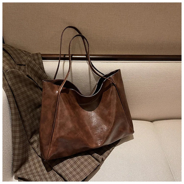 Bakre vy av elegant bucketväska. Kvinnors retro-stil axelväska, mångsidig handväska för vardagsbruk.