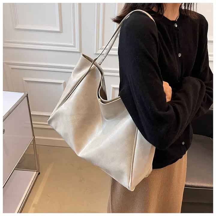 Elegant damsväska, bucketväska i stilrent material. Mångsidig axelväska, retro-stil handväska.