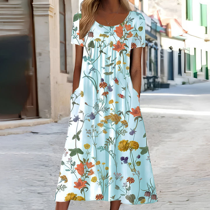 Trendig kvinnlig klänning med vackert blommönster, en stilren festklänning eller bekväm sommardress.