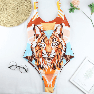 Bekväm kvinnors baddräkt i polyester med vilt leopard- & tigermönster, idealisk för semester.