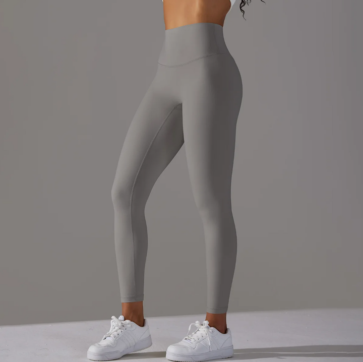 Löparleggings med stretch och hög midja för dam, designade för maximal rörelsefrihet.