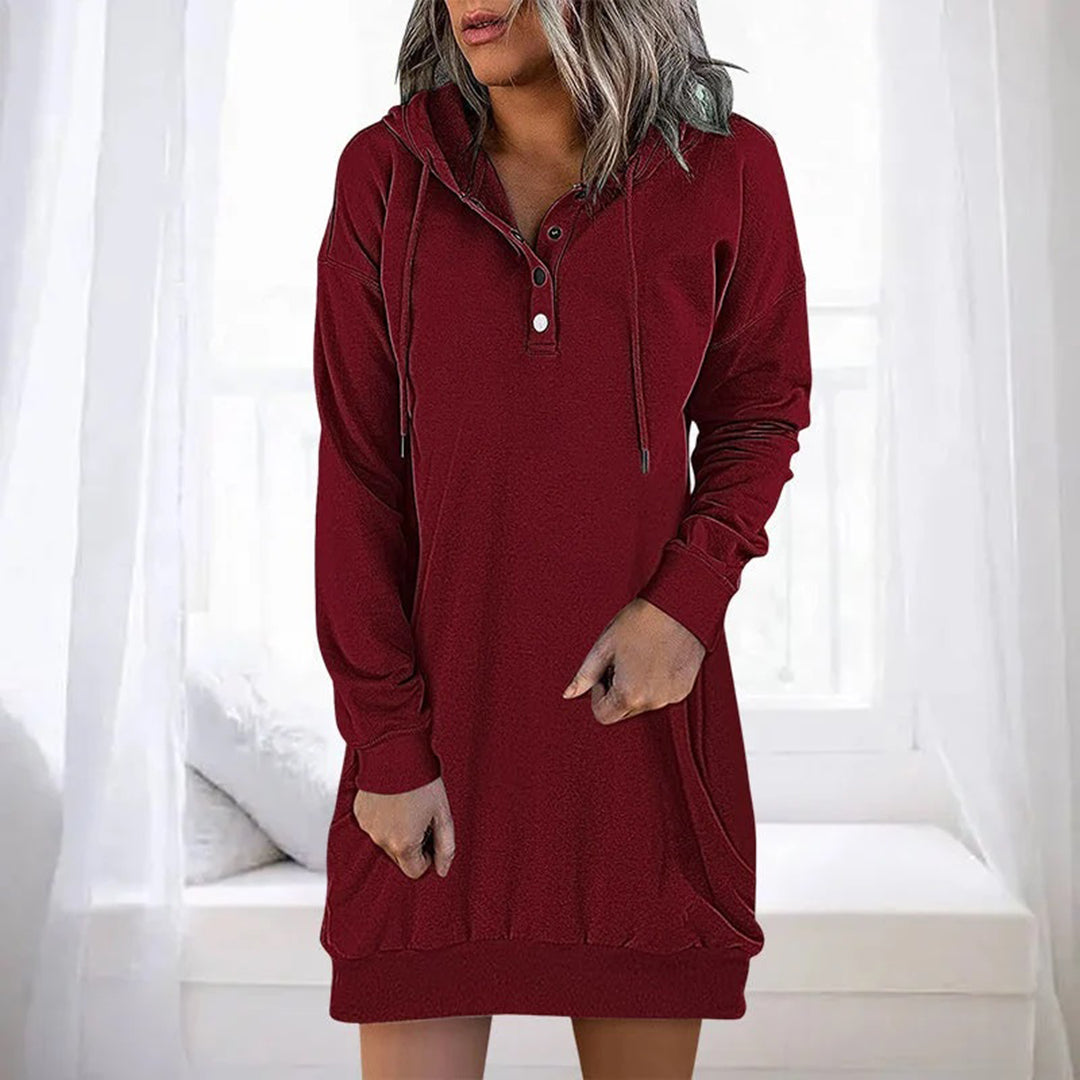 Elegant dam hoodieklänning, mångsidig för streetwear och höstmode. Avslappnad passform.