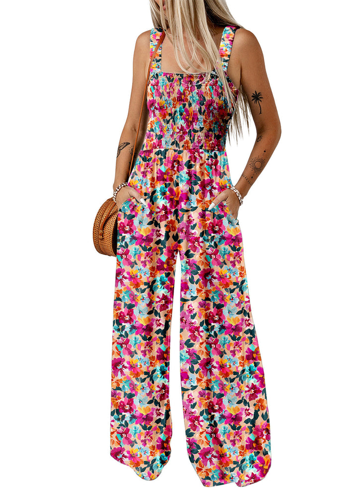 Elegant kvinnors byxdress med festligt blommönster och vida ben, idealisk för sommarevenemang.