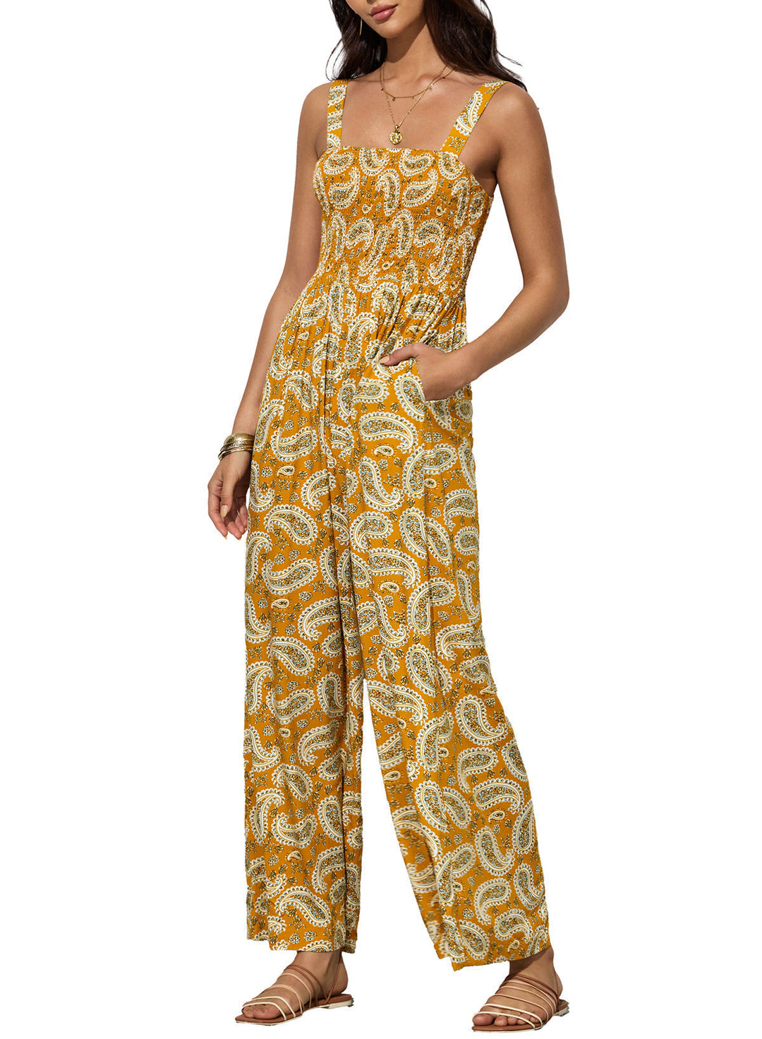 Färgrik kvinnors jumpsuit med unikt blommönster och vida ben, en trendig vår- och sommarbyxdress.