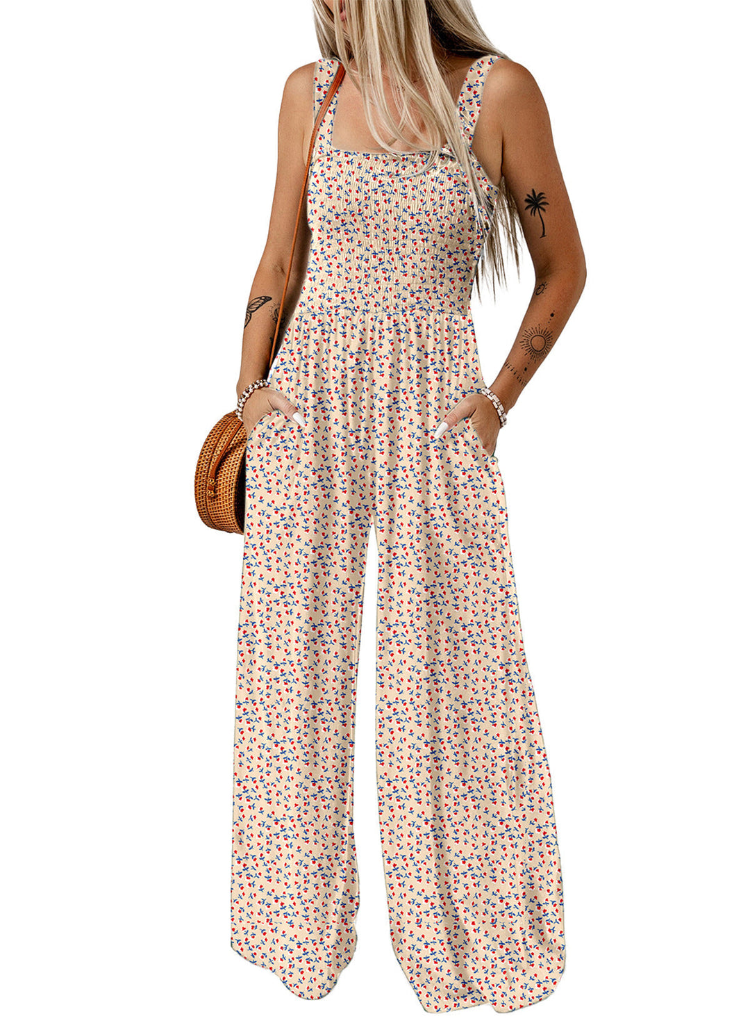 Byxdress för kvinnor med vida ben och vackert blommönster, för en elegant och luftig sommarlook.
