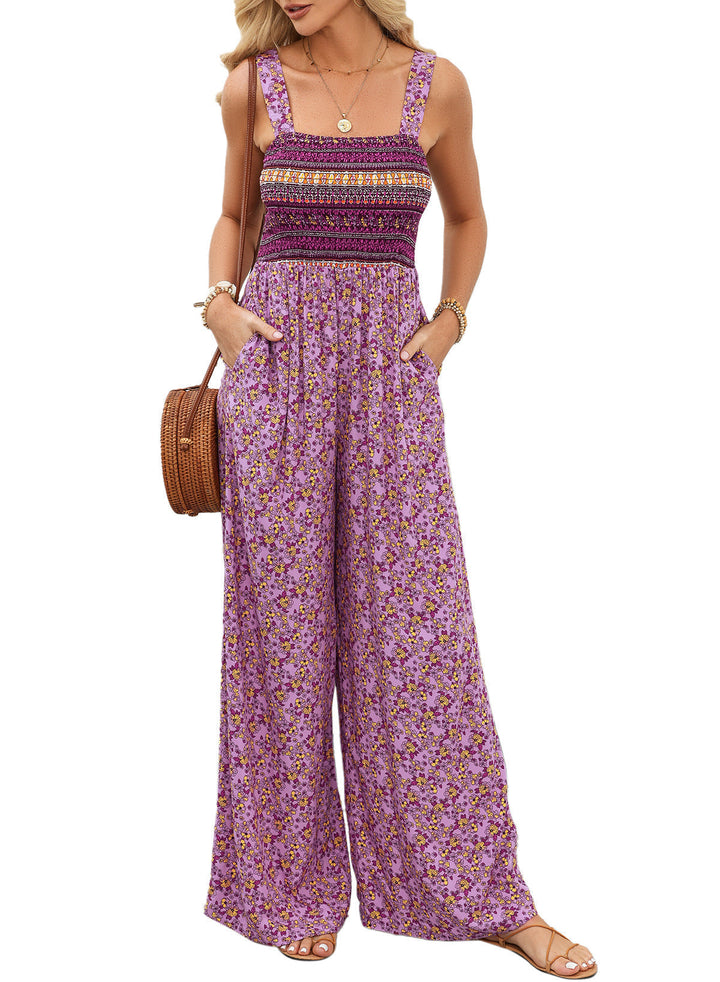 Modern kvinnors jumpsuit med vida ben och livfullt blommönster, en mångsidig modefavorit.