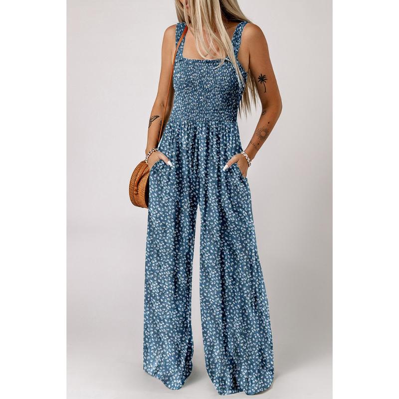 Mångsidig kvinnors jumpsuit med blommönster och vida ben, elegant för fest och bekväm för vardags.