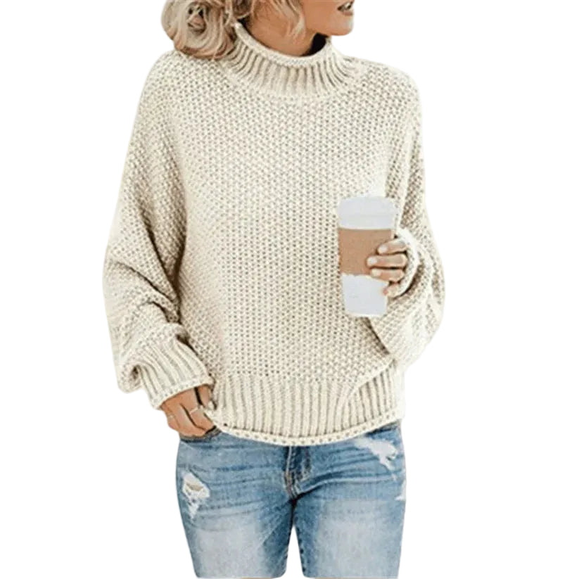 Kvinnors klassiska stickade tröja i lös passform, bekväm och elegant för vardag. Perfekt för höstmode i beige.