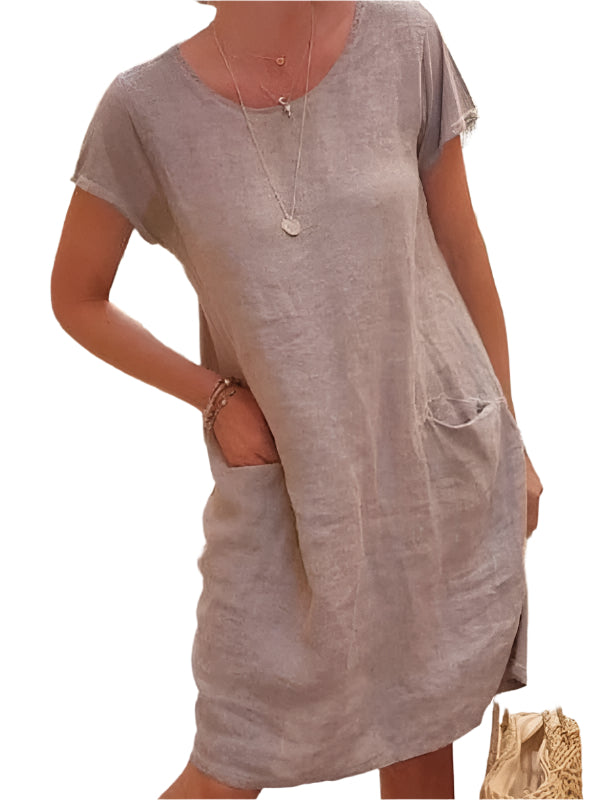 Kvinnors kortärmad linneklänning i linne-stil. Perfekt som avslappnad sommar- och vårklänning. Rundhalsad design.