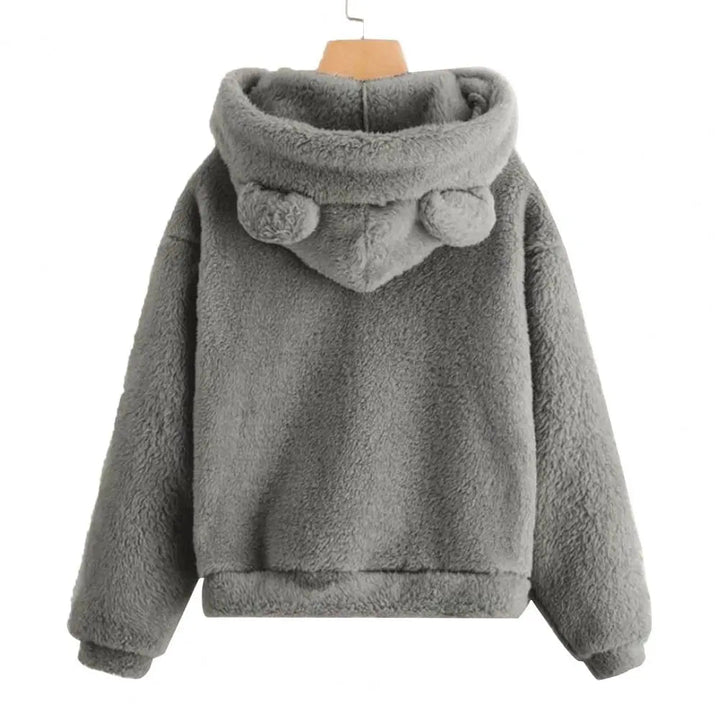 Lekfull damhoodie med kaninöron och mysig luva. Trendig och avslappnad för modeintresserade.